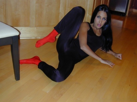 Alluring brunette Amia Miley removes leggings in socks and a thong