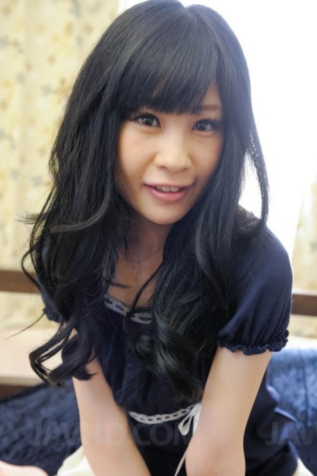 Adorable Japanese girl Mizutama Remon engages in POV sex upon a bed