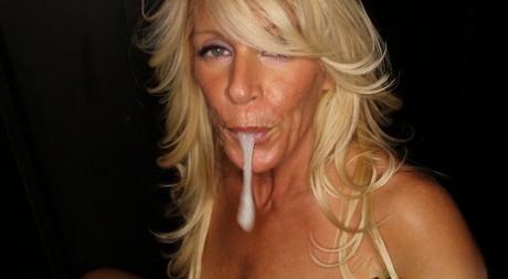 Mature MILF Gina plays with a mouthful of cum after gloryhole suck off