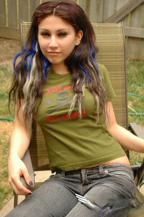 Sweet petite amateur Angel flaunting her perky small tits in the backyard