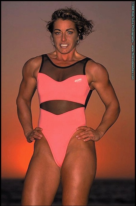 Bodybuilder Kelly Oreilly models swimwear when not pumping iron on a beach