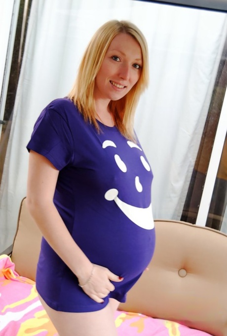 Pregnant blonde gets naked on a bench seat while wearing flip-flops