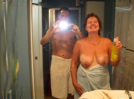 Busty older lady Busty Bliss engages in oral sex with her man friend