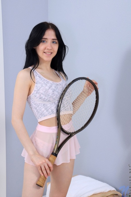 Petite brunette Emili Heads spreads her tight pink pussy in pink leg warmers