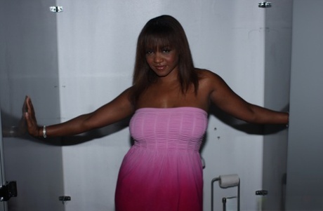 Cheeky black chick Sinnamon Love whips out hot big boobs for gloryhole titjob