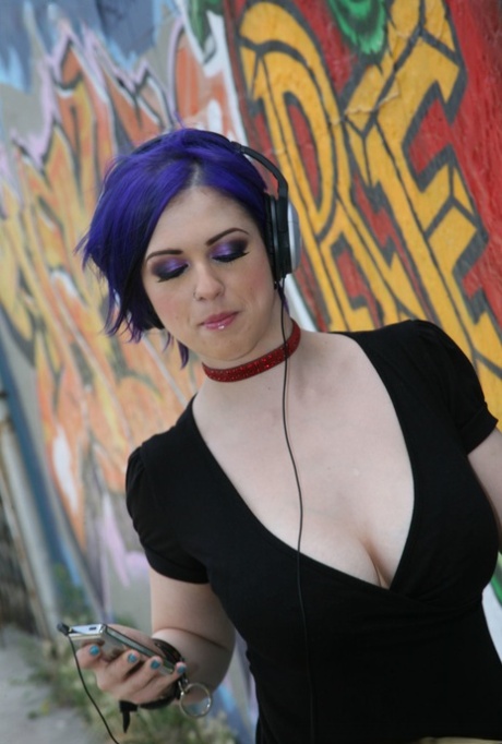 Punk rocker Larkin Love sports dyed hair during an interracial gangbang