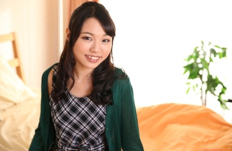 Asian sweetie Hitomi Maisaka opens her mouth for a dick before sex