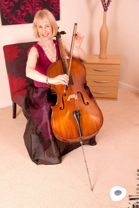 Mature musician Hazel strips and masturbates in her sexy nylon stockings