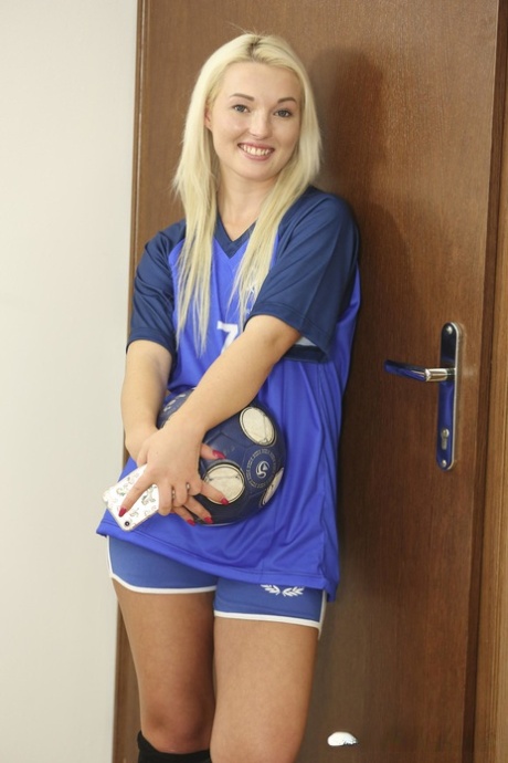 Blonde soccer babe Lovita Fate strips off her uniform and masturbates