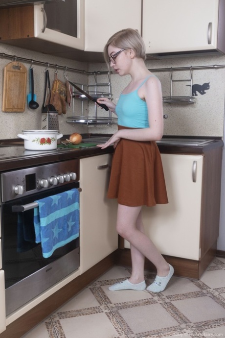 Amateur teen Abby shows off her hairy pussy & armpit in the kitchen
