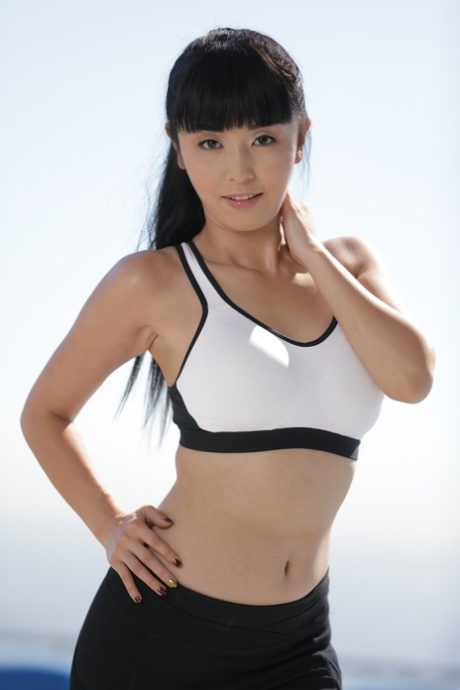 Fit Asian hottie Marica Hase strips her top and sexy yoga tights to pose nude