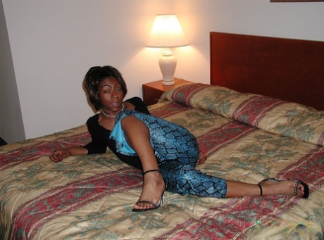 Horny ebony Colette takes off her clothes and sticks rubber toy in her twat