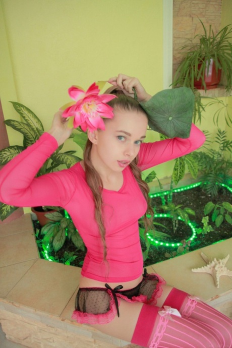 Cute teen Milena D spreads her furry vagina while posing in her pink lingerie