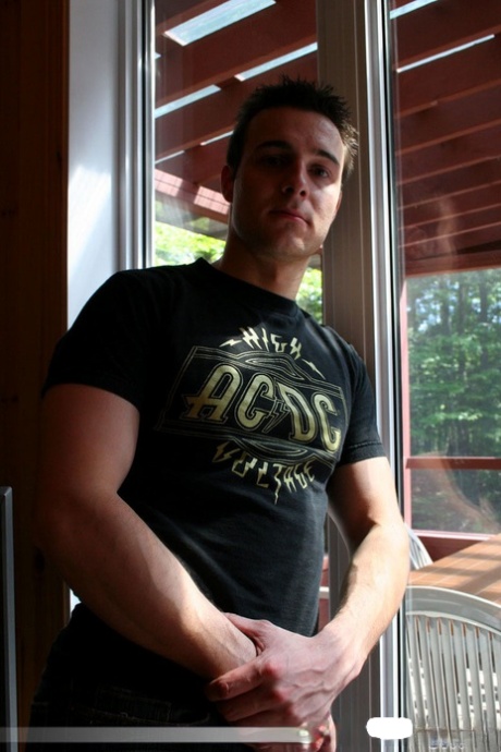 Gay hunk in an ACDC shirt Kevin Keyes reveals his fat dong and masturbates