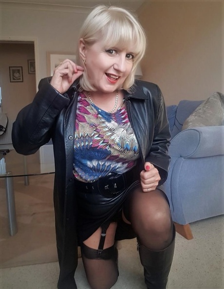 Fat mature Lorna Blu slowly exposes her big tits and big ass in a garter belt