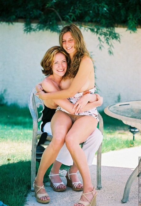 Amateur hotties Paulina & Sarah flaunt their natural tits and pussies outside