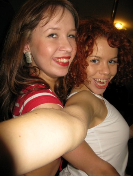 Two gorgeous amateur girls stripping and posing naked in hot lesbian action