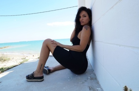 Brunette Spanish babe Claudia Bavel undresses and teases with her amazing body