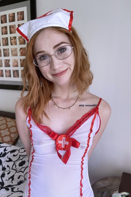 Skinny redheaded nurse Scarlet Skies shows her big ass & holes up close