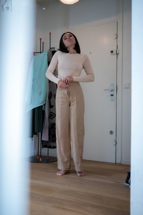 Amateur Eve S reveals her natural tits and nice ass while dressing in her room