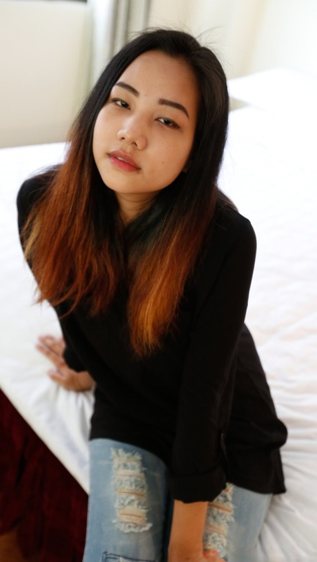 Beautiful Asian babe Meew shows off her stunning big boobs up close