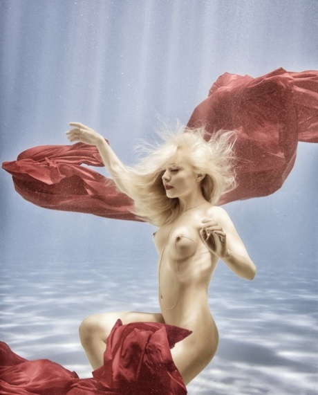 Little Dutch babe Amber Bassick sunbaths & swims at the Playboy photoshoot