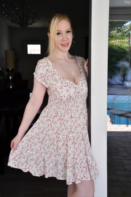Curvy blonde babe Gigi shows off her saggy big tits and toys her muff