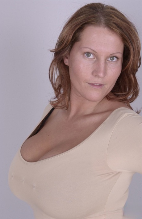 Tall Euro mom Laura Orsolya teases with her natural knockers as she strips