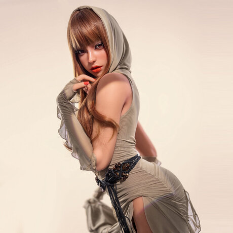 Redheaded warrior silicone sex doll strips to her boots & shows her big ass